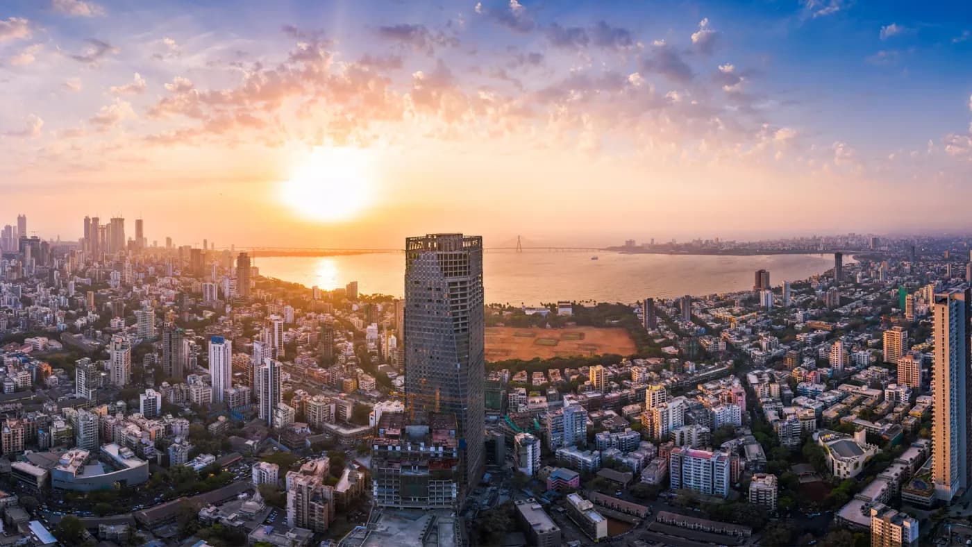 The Bandra Worli Sea Link is seen passing over the Mahim Bay, with the city around it. Dadar, Prabhadevi, Lower Parel, Worli, Matunga, Mahim and Bandra can be seen.