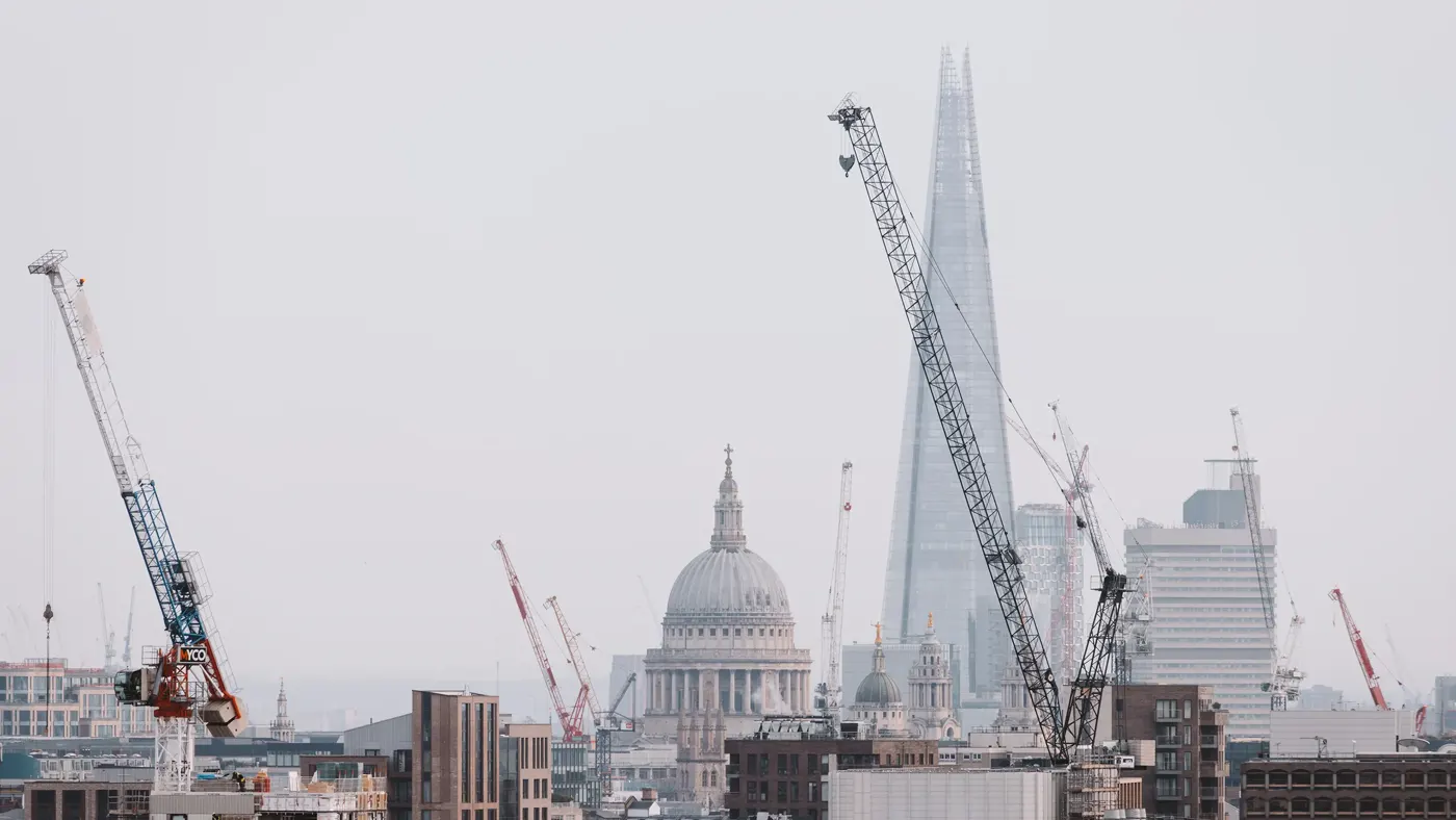 London cityscape skyline with iconic landmark buildings in The City with dramatic stormy sky