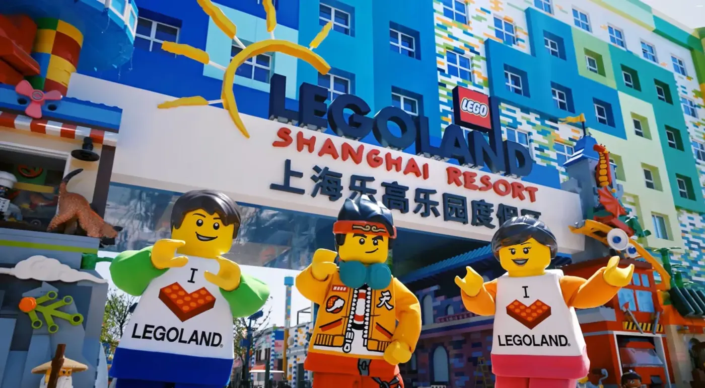Colourful entrance to LEGOLAND Shanghai Resort with large LEGO character figures outside.